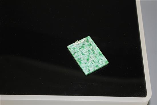 A carved jadeite and diamond set rectangular pendant, both sides decorated with Chinese characters and scrolls, 53mm,